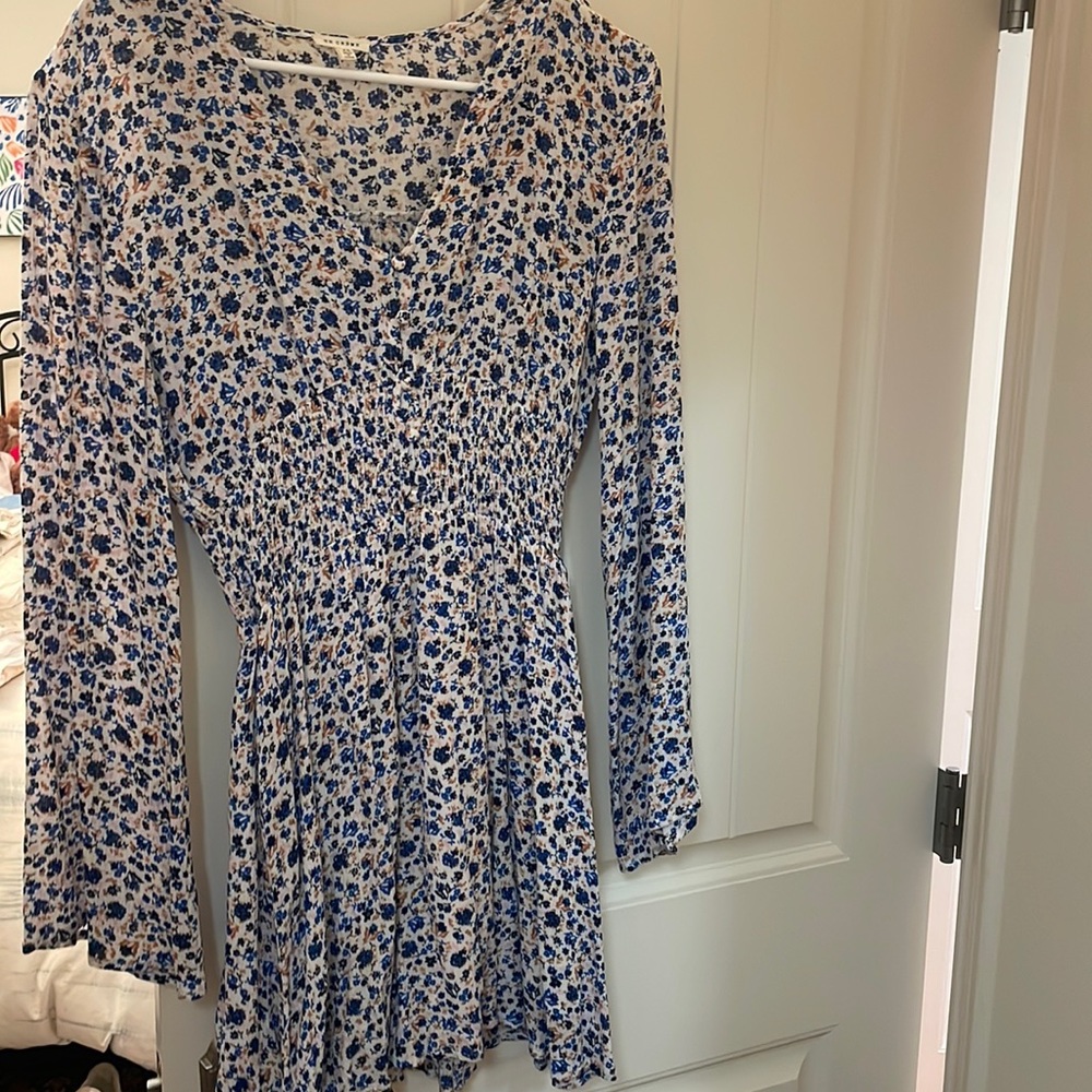 En creme mini dress, from a small boutique